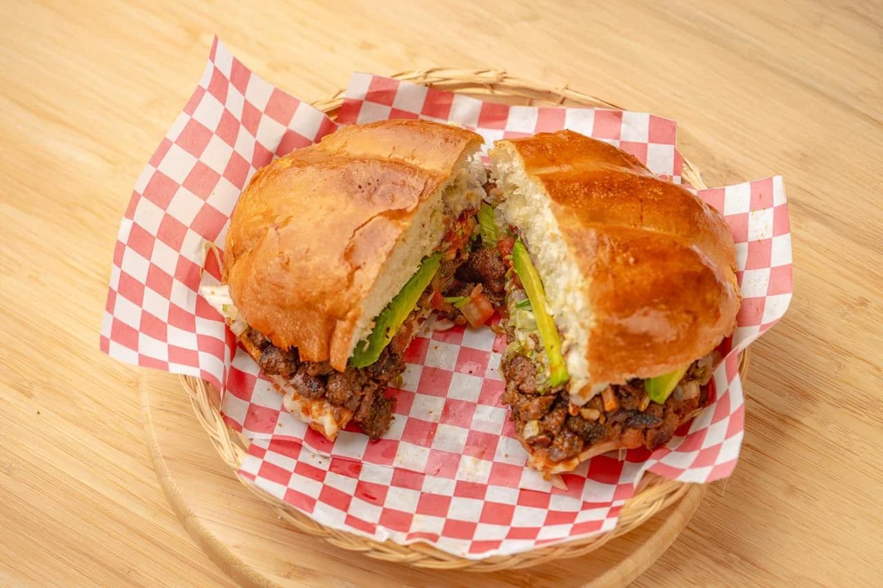 Mexican torta sandwich with meat and vegetables